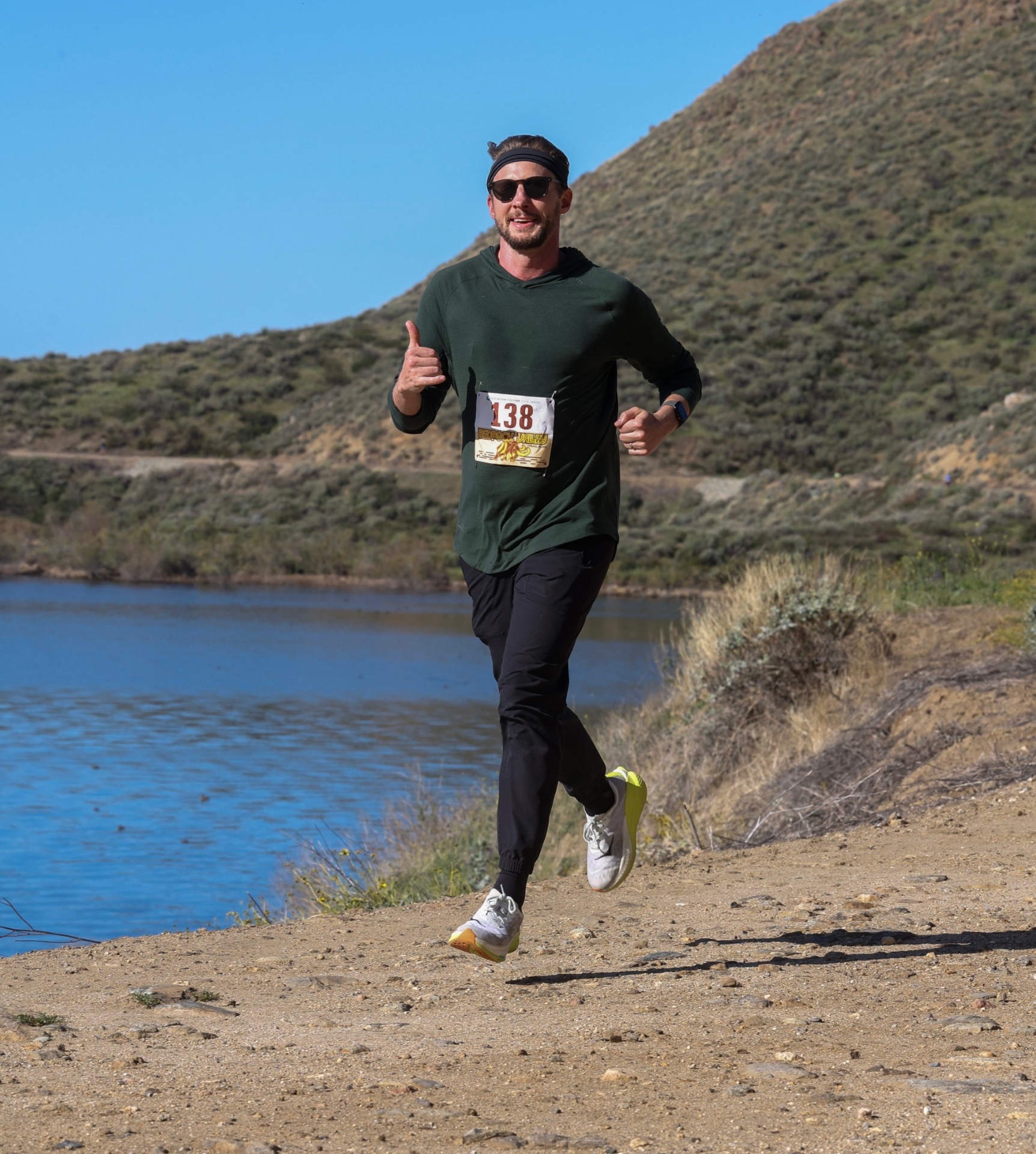 Coach Will running on a trail